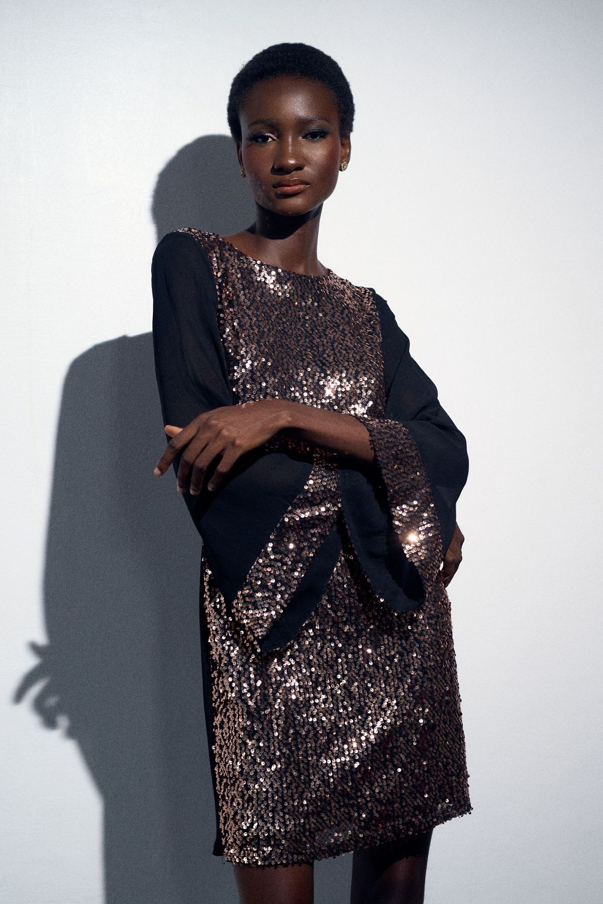 Model in a sequin dress in a Lagos studio